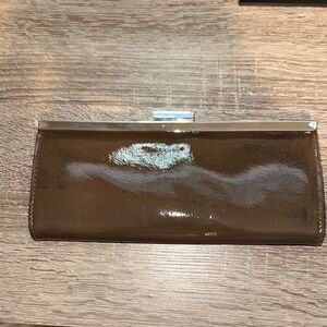 Sophisticated Brown Patent Leather Wristlet with Metallic Trim